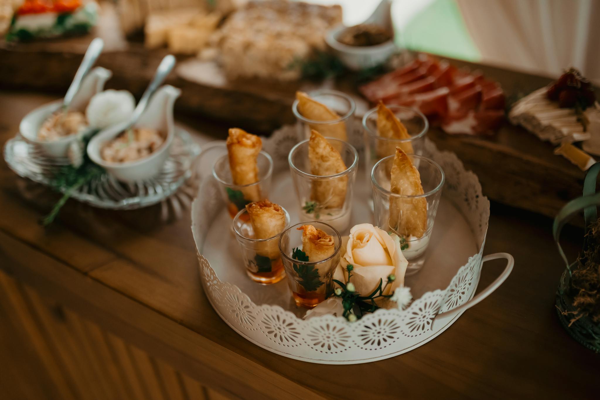 Stylish presentation of appetizers on a tray, perfect for weddings or celebrations.